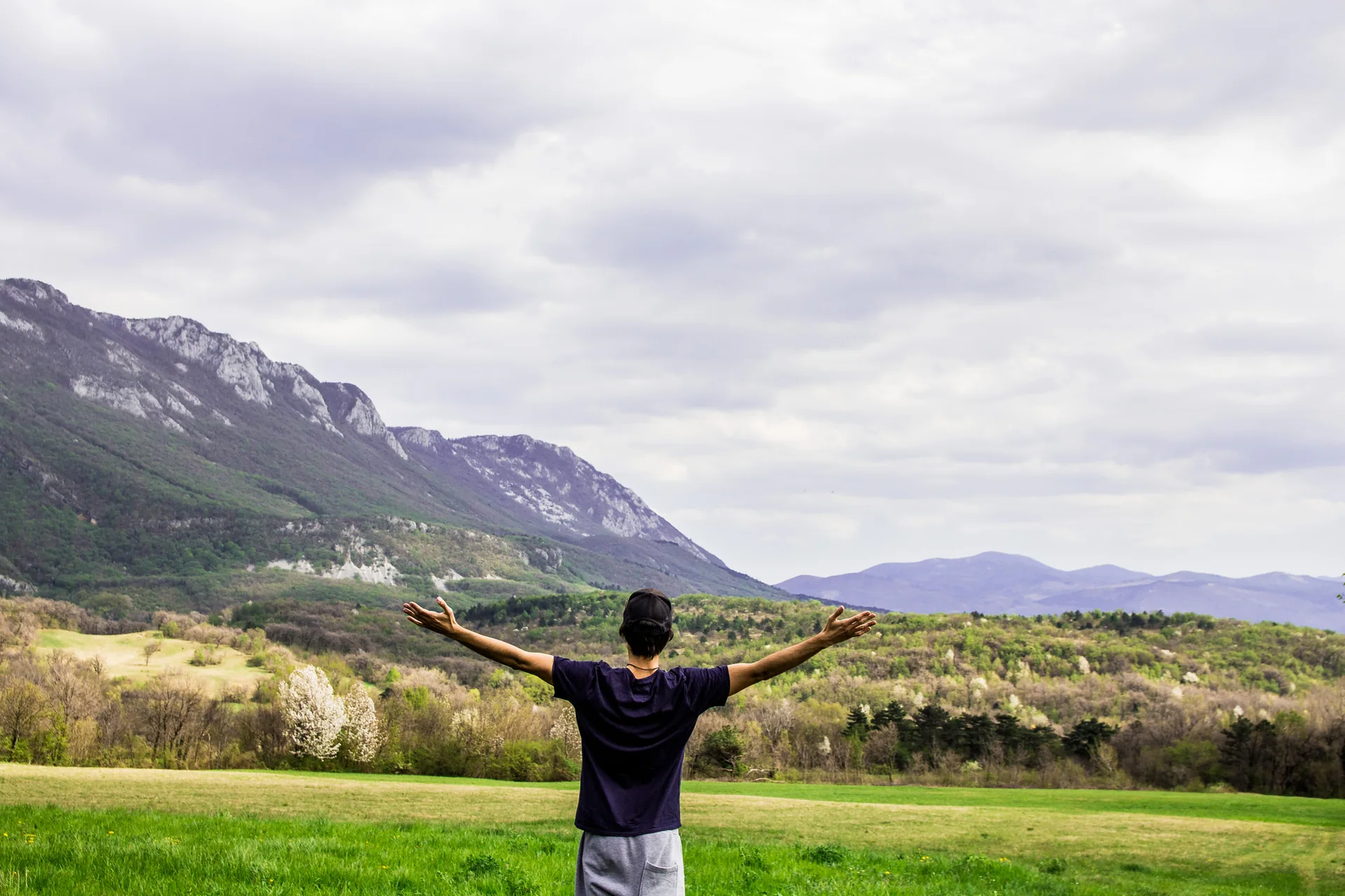 Person embracing freedom outdoors after long COVID recovery